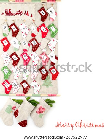 Christmas textile calendar with colored socks. A Christmas background with a place for the text.