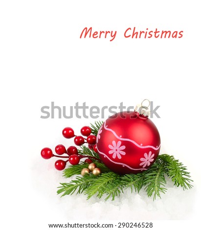 Red Christmas ball with a pattern and red berries on branches of a Christmas tree. A Christmas background with a place for the text.