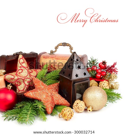 Christmas balls, stars and lamp near wooden chests on a white background. A Christmas background with a place for the text.