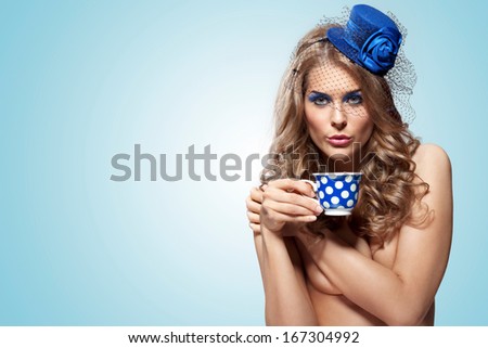 Vintage Photo Of Cute Pin-Up Girl In Retro Hat Drinking Tea.
