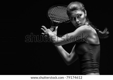 Ready to hit! Female tennis player with racket ready to hit a tennis ball.