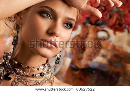 Glamorous. A portrait of a young glamorous woman wearing stylish necklace and pierced earrings.