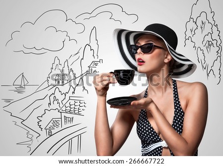 Creative vintage photo of a beautiful pin-up girl drinking tea on sketchy landscape background.