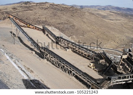 Conveyor belts for crushed roadstone at asphalt manufacturing.