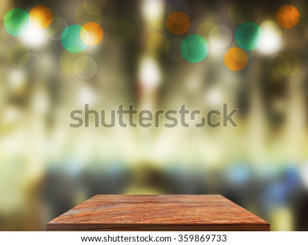 Old wood table top on  blurred light abstract background . use  for display or montage your products top on  blurred light abstract background .