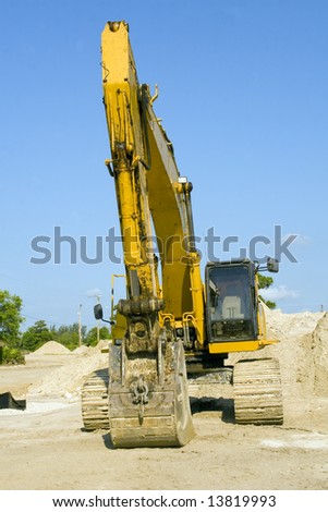 A backhoe sits idle over the weekend break