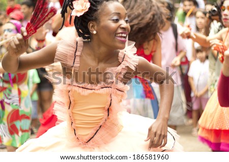NITEROI, BRAZIL - MAY 6, 2012: A woman dances dressed up as a ballerina during a street parade in Brazil. May 6, 2012 in Niteroi, Brazil.