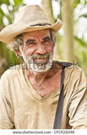 JAPERI, BRAZIL - NOVEMBER 22, 2013: Elderly man on a rural community smiles while waiting the governmental ceremony for the issuance of land possession. November 22, 2013 in Japeri, Brazil