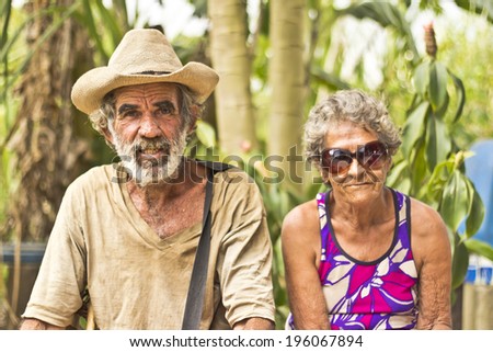 JAPERI, BRAZIL - NOVEMBER 22, 2013: Elderly couple on a rural community rests while waiting the governmental ceremony for the issuance of land possession. November 22, 2013 in Japeri, Brazil