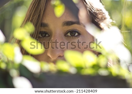 Girl through the bushes in an abandoned house