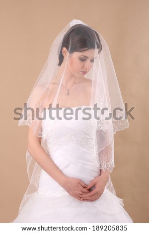Sensuality. Woman with Transparent Wedding Veil