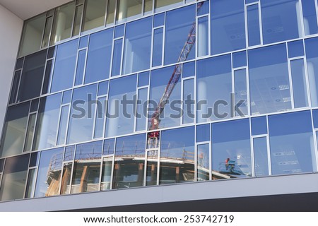 Milan, Italy - February 11, 2015: Skyscraper glass reflecting work in progress in the city