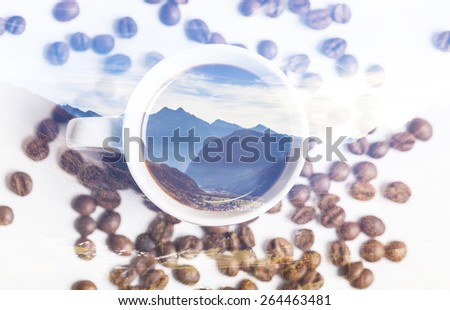 Double exposure of mountainscape and cup of coffee