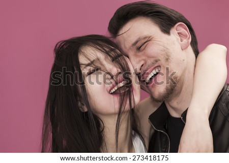 Happy girl portrait with messy hair and her boyfriend