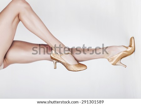 Beautiful dancer legs wearing ballet shoes horizontal