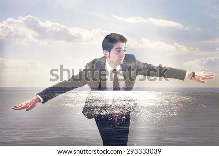 Double exposure of businessman flying and seascape