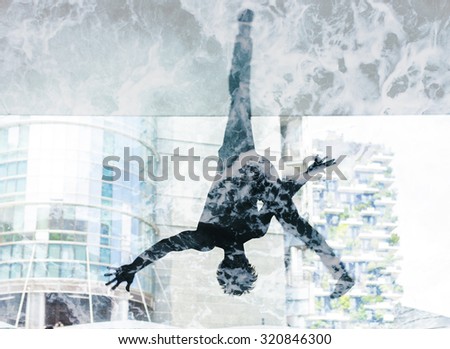 Double exposure of dancer silhouette and sea foam texture