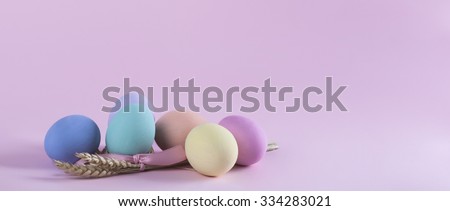 Colorful Easter eggs composition with sheaf of wheat letterbox