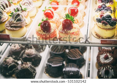 Beautiful and delicious mini cakes in pastry shop
