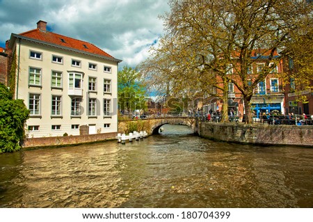 BRUGES, BELGIUM - APRIL 20: Houses along the canals of Brugge or Bruges, Belgium on April 20, 2012. Bruges is frequently referred to as \