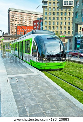 BILBAO, SPAIN - APRIL 25, 2010: The tram lane covered with grass in Bilbao, Spain on 25 April 2010. You can travel by different means of transport in the city of Bilbao.