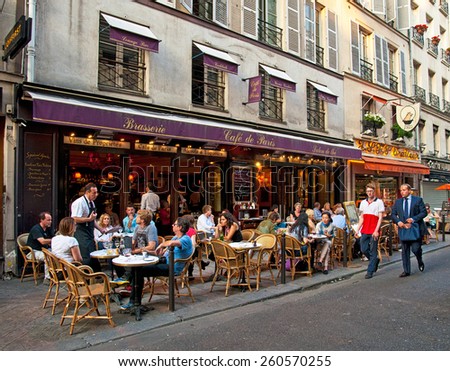 PARIS, FRANCE - 8 SEPTEMBER, 2014: Typical bar in the old town of Paris, France on 8 September 2014. . Paris is one of the most populated metropolitan areas in Europe full of bars and cafes.