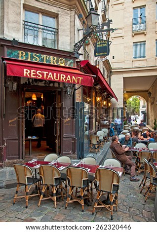 PARIS, FRANCE - 07 SEPTEMBER, 2014: Typical bar in the old town of Paris, France on 7 September 2014. . Paris is one of the most populated metropolitan areas in Europe full of bars and cafes.