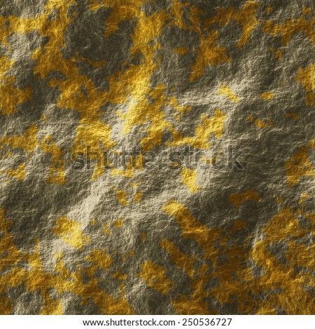 Golden blots splattered on grey stone. Texture or background.