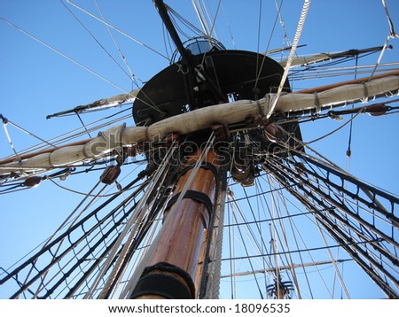 looking up at ship mast with ropes and knots