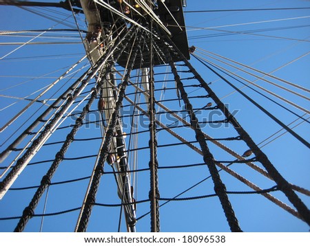 looking up at ship mast with ropes and knots
