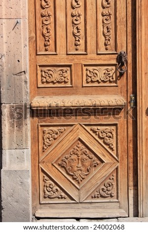 Old carved wood door panel; Morelia, Mexico