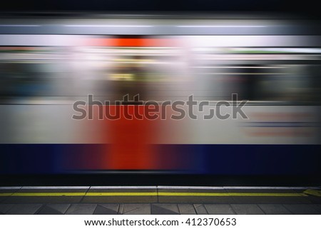 Passing train on the London tube platform.