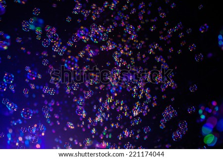 Abstract colorful soap bubbles wallpaper isolated on black background