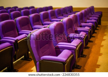 Empty hall for presentation with purple armchairs