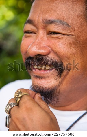 Happy smiling 58 year old elder senior man portrait