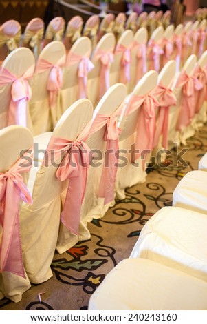 Chairs for the event or wedding reception party. Wedding table decorations in the restaurant. Valentine's Day dinner with elegant jewelry holiday heart.
