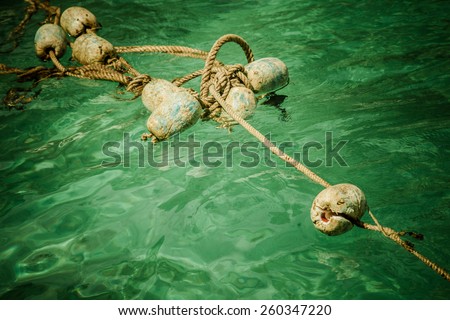 buoy rope barrier on the water with floats