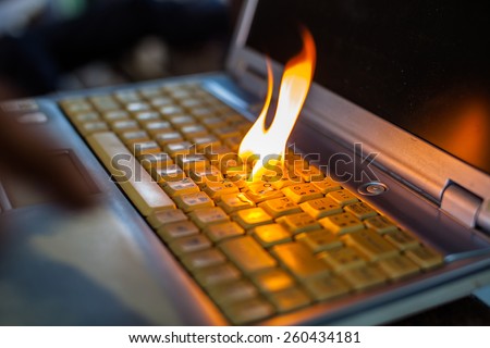 Computer laptop sleeve is on fire. Means love burns up the internet to set the world on fire damaged computers, insurance claims, etc. Hell.