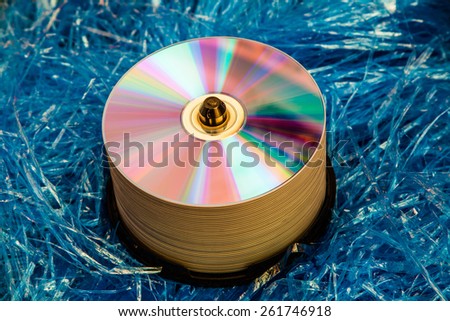 Close up view of the compact disc on a blue background material objects.