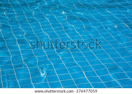 Blue sparkling water in swimming pool