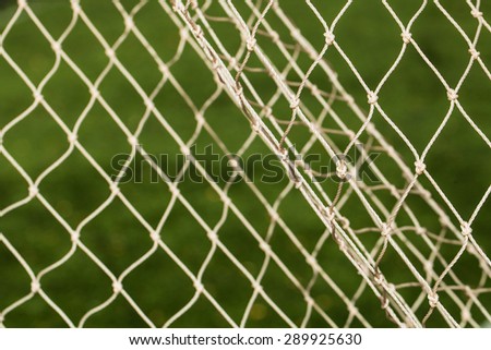 Soccer Goal Net with Green Grass Background