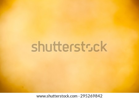 A soft glowing golden yellow bokeh background in landscape (horizontal) orientation.