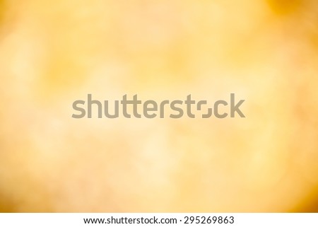 A soft glowing golden yellow bokeh background in landscape (horizontal) orientation.