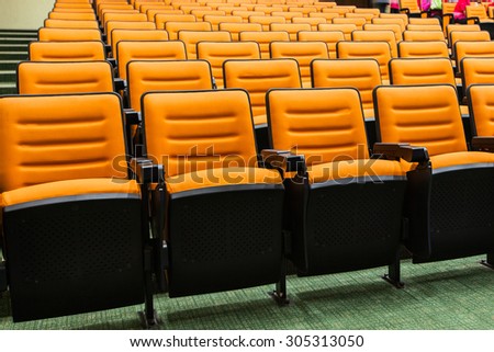 Empty movie theatre chairs background