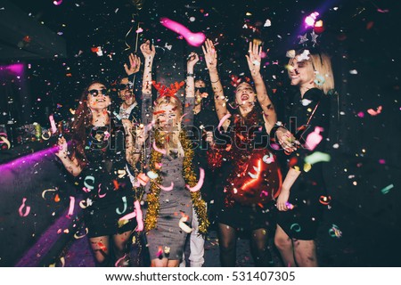 Group of friends at club having fun. New year\'s party