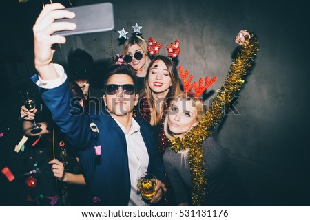 Group of friends at club making selfie and having fun