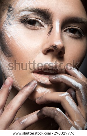 Girl with creative make-up in black and white. Art beauty face. Picture taken in the studio