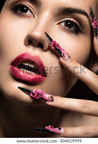 Beautiful girl in mask with long nails and sensual lips. Beauty face.