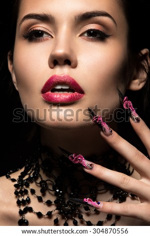 Beautiful girl  with long nails and sensual lips. Beauty face.