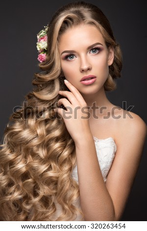 Beautiful blond woman in image of the bride with flowers. Beauty face and Hairstyle